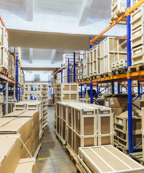 Logistic and distribution warehouse. Empty warehouse full of cargo. Cardboard boxes